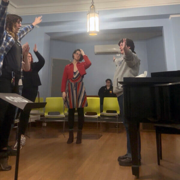 A few members of a choir reherses