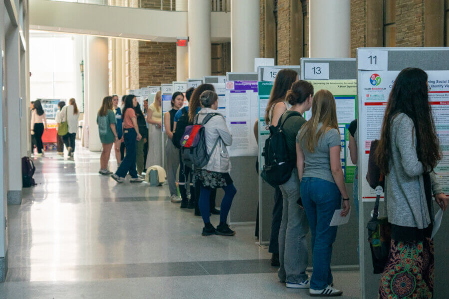 Students show off research projects during annual poster symposium