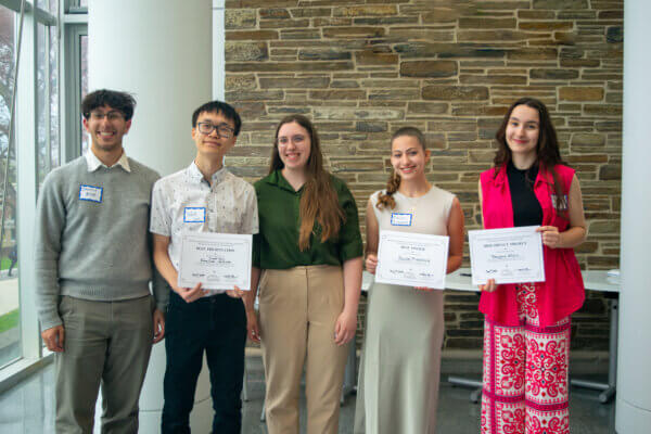 Students holding their awards