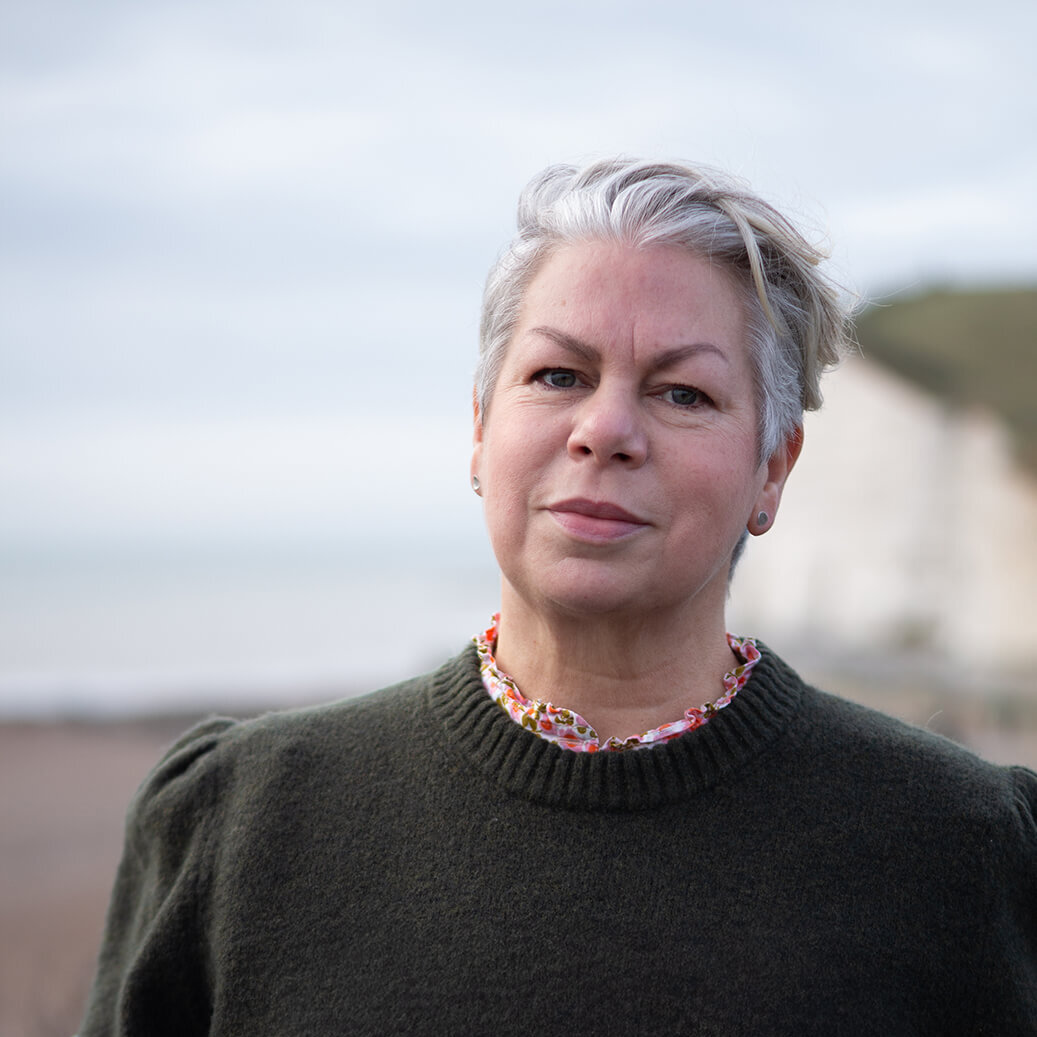 A woman with a black sweater