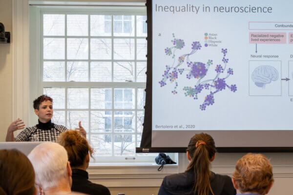 Marlen Z. Gonzales explains what Community Neuroscience is to the attendees at the final Talks at Twelve.